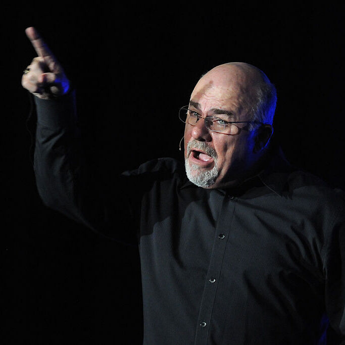 Dave Ramsey giving an impassioned speech pointing his figure in the air