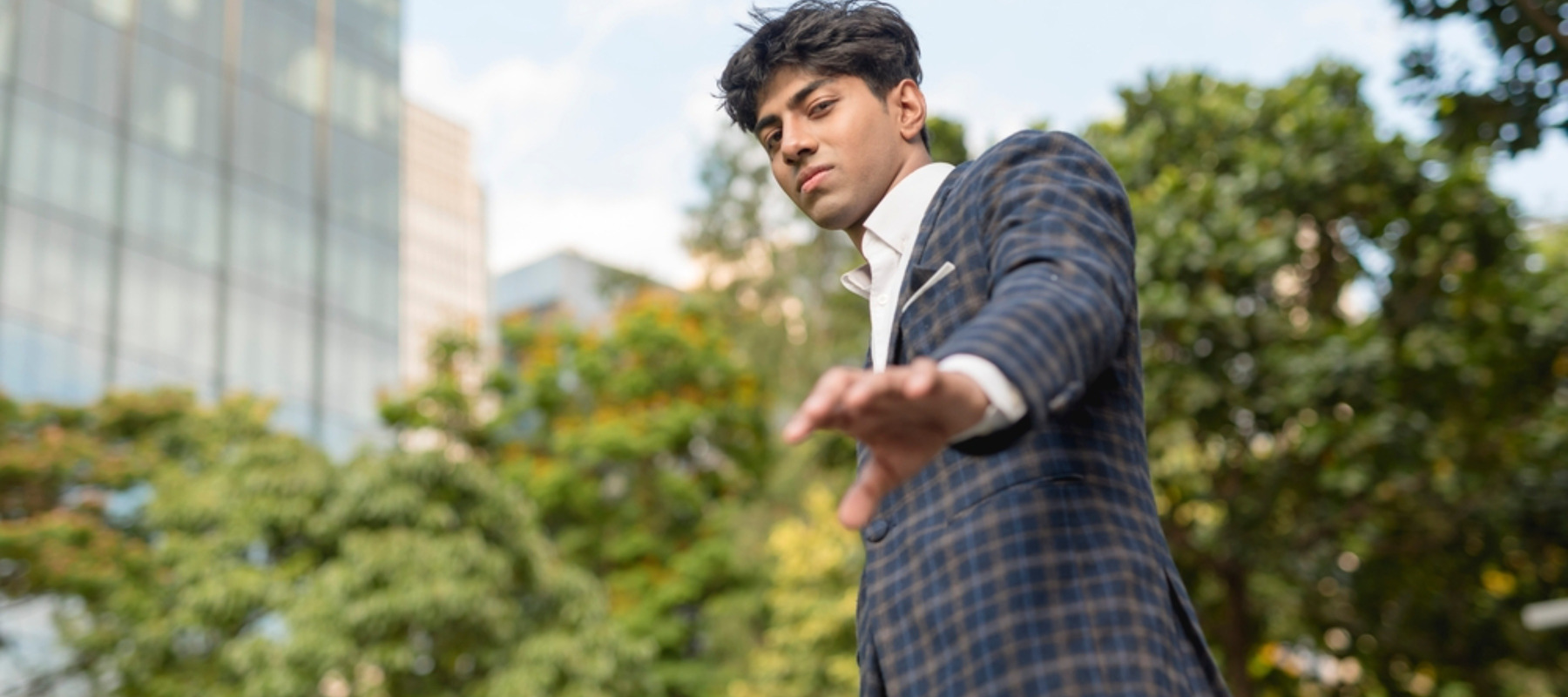 Young professional man in a checkered business suit