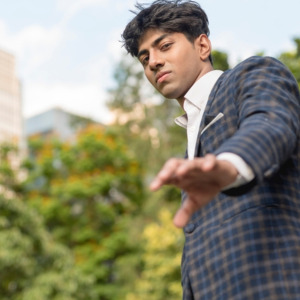 Young professional man in a checkered business suit