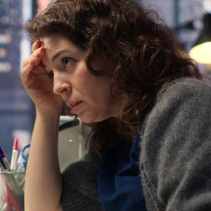 Day trader feeling worried and stressed looking at monetary losses, analyzing stock price trends