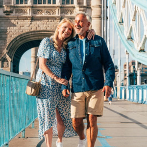 Man and woman on vacation walking together looking in love