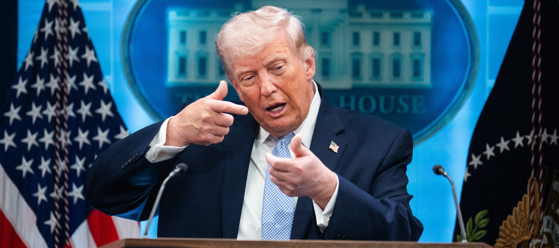 President Donald Trump mimics firing a gun during a news conference in the White House briefing room