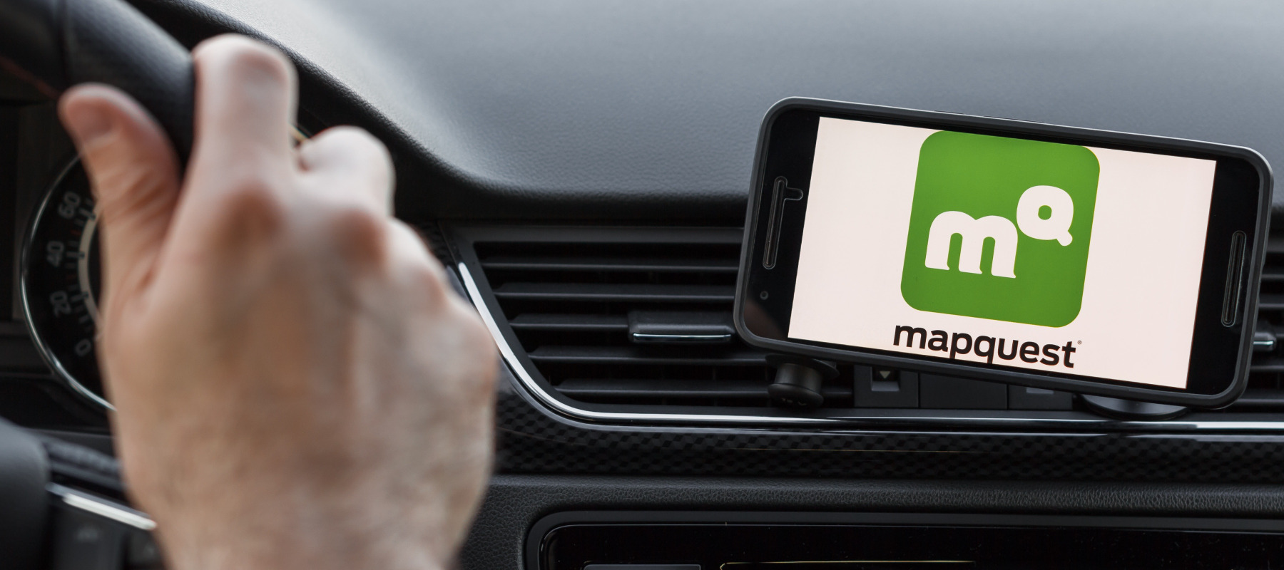MapQuest app on phone while person is driving