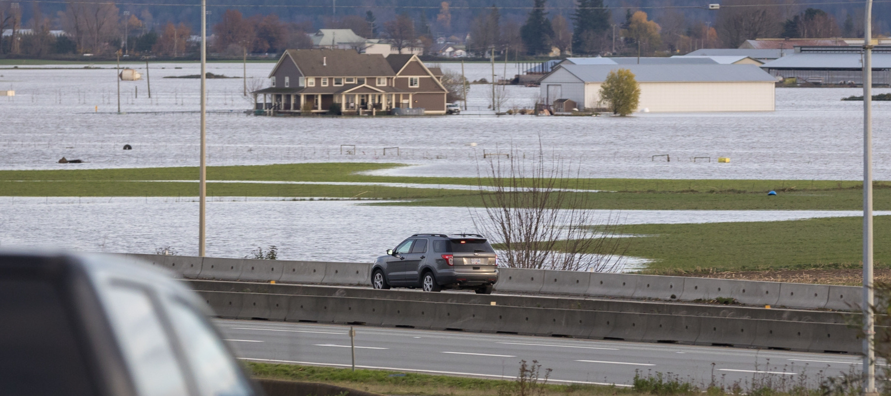 Road closed signs due to infrastructure damage caused by flooding from heavy rain in the Fraser Valley.