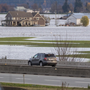 Road closed signs due to infrastructure damage caused by flooding from heavy rain in the Fraser Valley.