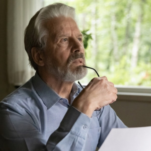 Pensive elderly male