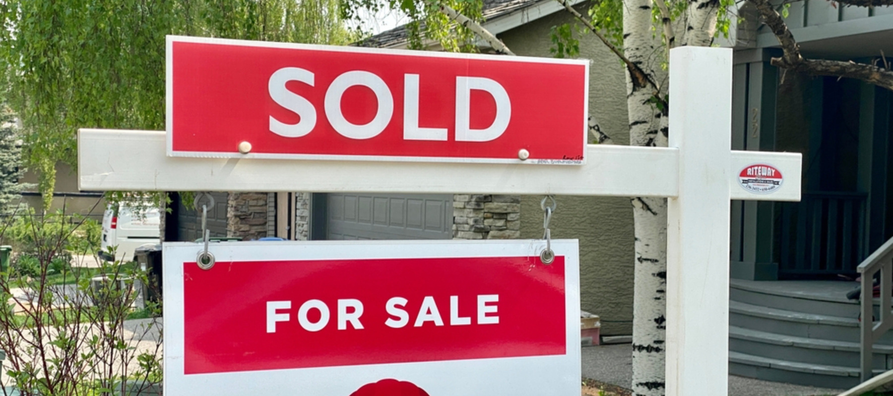 Home for sale with a sold sign