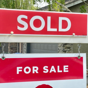 Home for sale with a sold sign