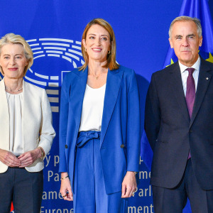 European Commission President Ursula von der Leyen, European Parliament President Roberta Metsola and Canadian Prime Minister Mark Carney pose for a group photograph