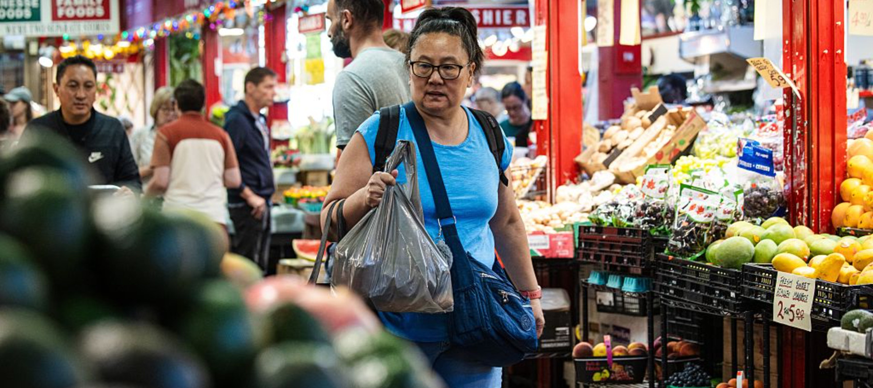People shop inside of St. Lawrence Market
