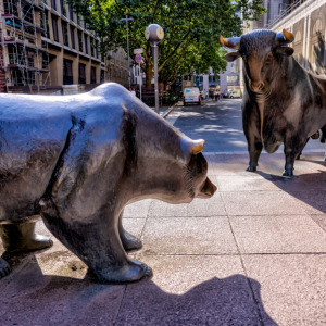 Image of TSX on a mobile phone + Bull and Bear sculptures by Reinhard Dachlauer in front of the Frankfurt, Germany stock exchange building