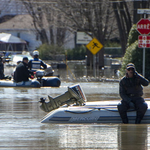 Rescue on a street submerged in flood waters in the Montreal suburb of Sainte-Marthe-sur-le-Lac, Quebec, Canada, April 29, 2019.