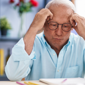 Frustrated older employee at a desk