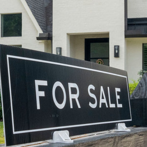 Stressed couple looking at home prices