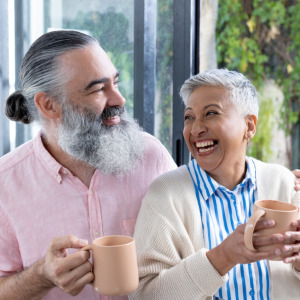 Bank of Canada building + Happy retired couple drinking coffee