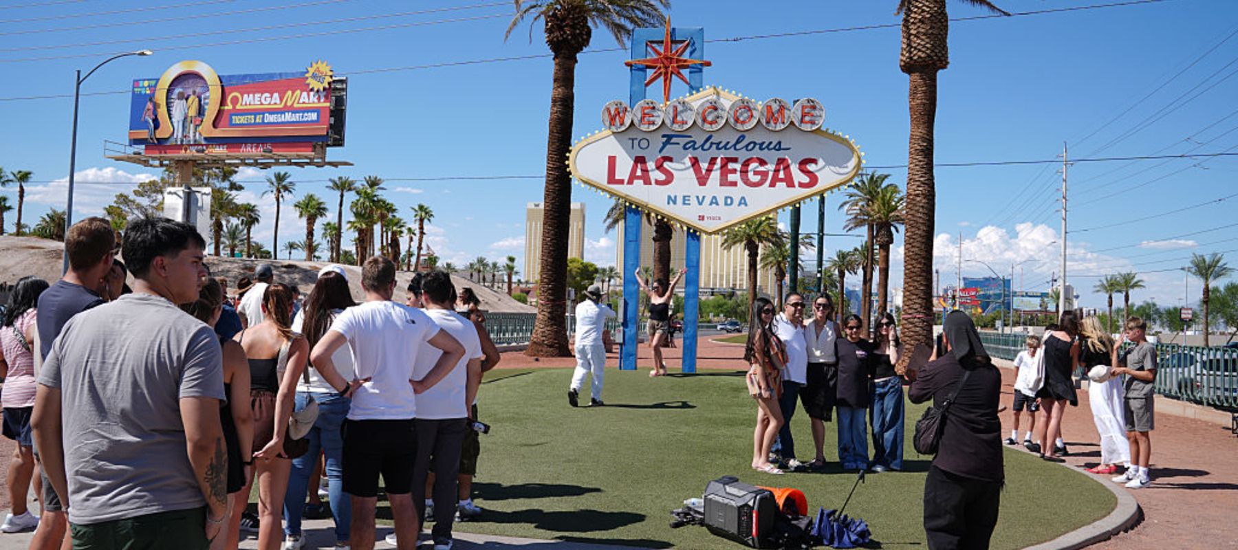 Tourists taking photo in front of Welcome to Las Vegas sign