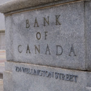Young pregnant woman buying baby stroller + Bank of Canada building
