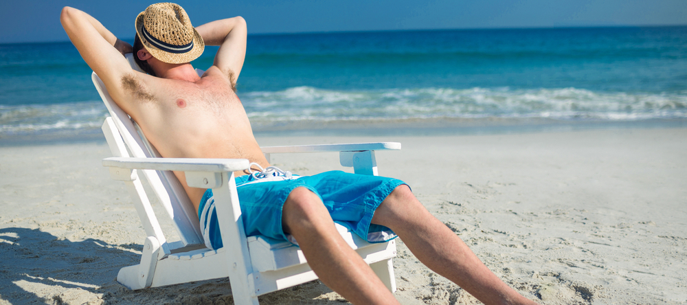 Man relaxing on a beach chair at the beach