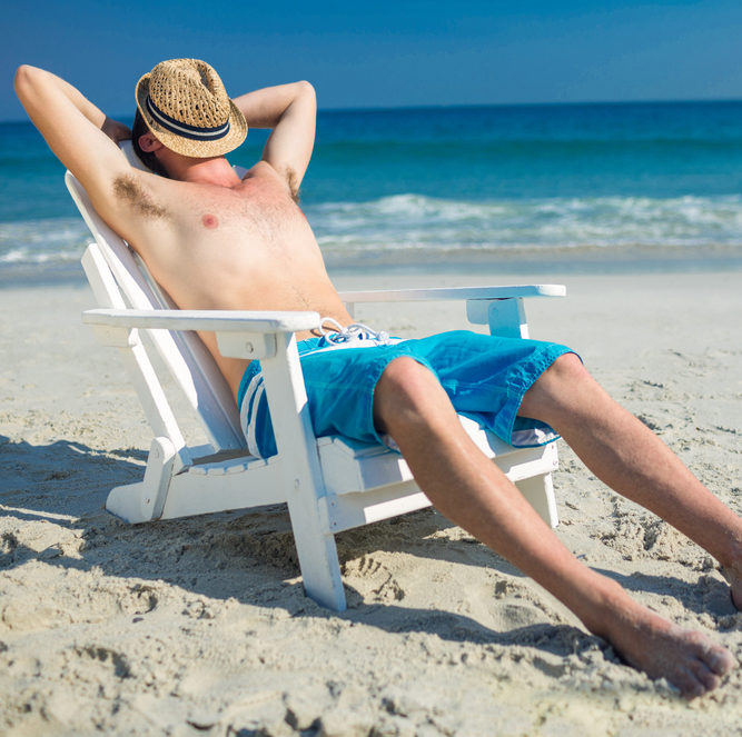 Man relaxing on a beach chair at the beach